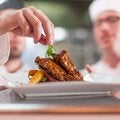 chefs plating fine dining food