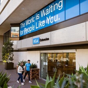 Students walking into UCLA Extension main entrance at the Gayley Center